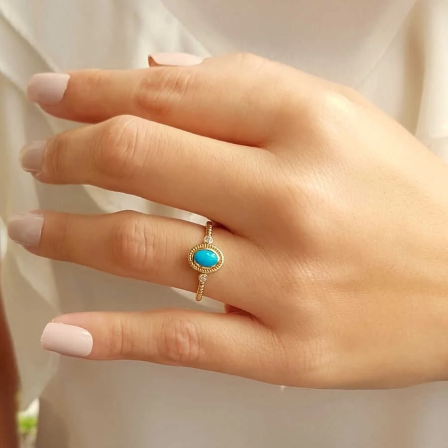 Oval Turquoise Stone Twisted Sleeve Pattern Gold Ring